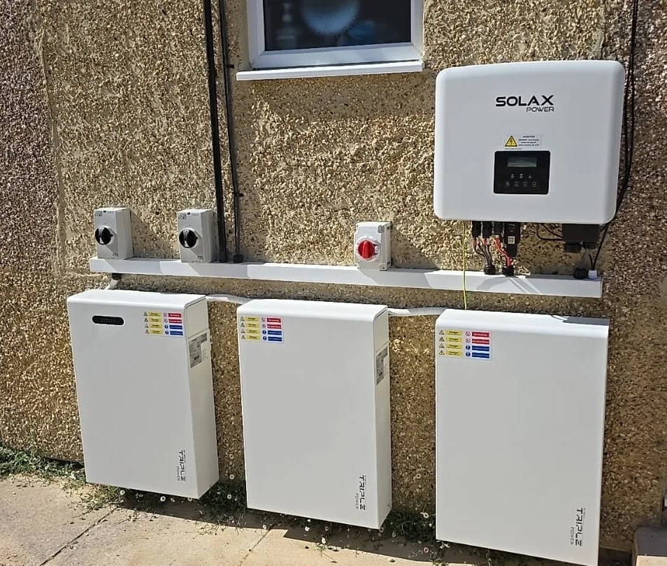 SolaX Gen4 hybrid inverter and Triple Power battery modules on external wall in Swindon