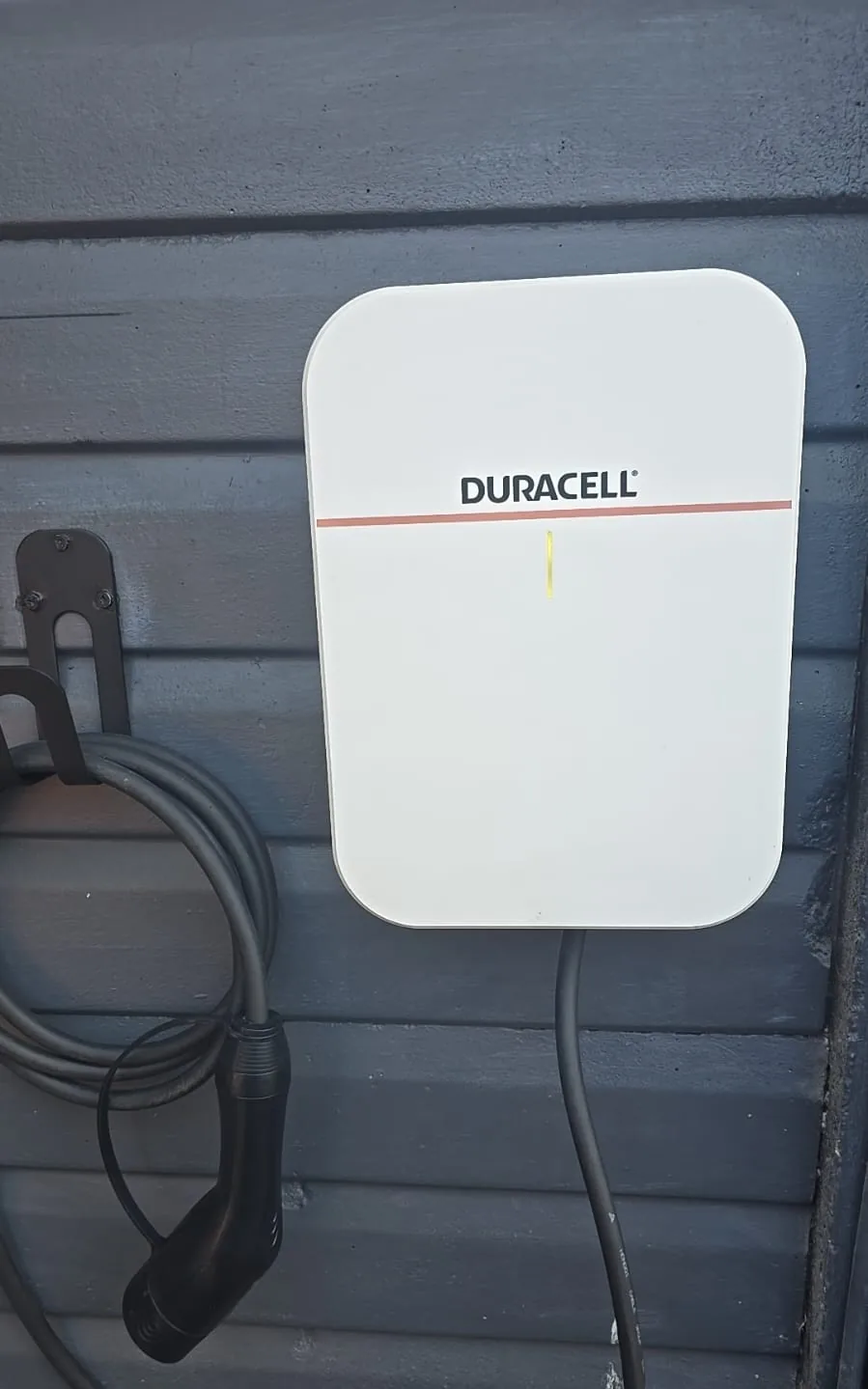 Finished 7.4kW Duracell EV Charger installation mounted on exterior wall in Leighton Buzzard